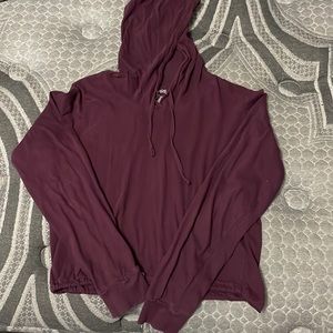 Violet hoodie crop top with a drawstring around the end of the hoodie